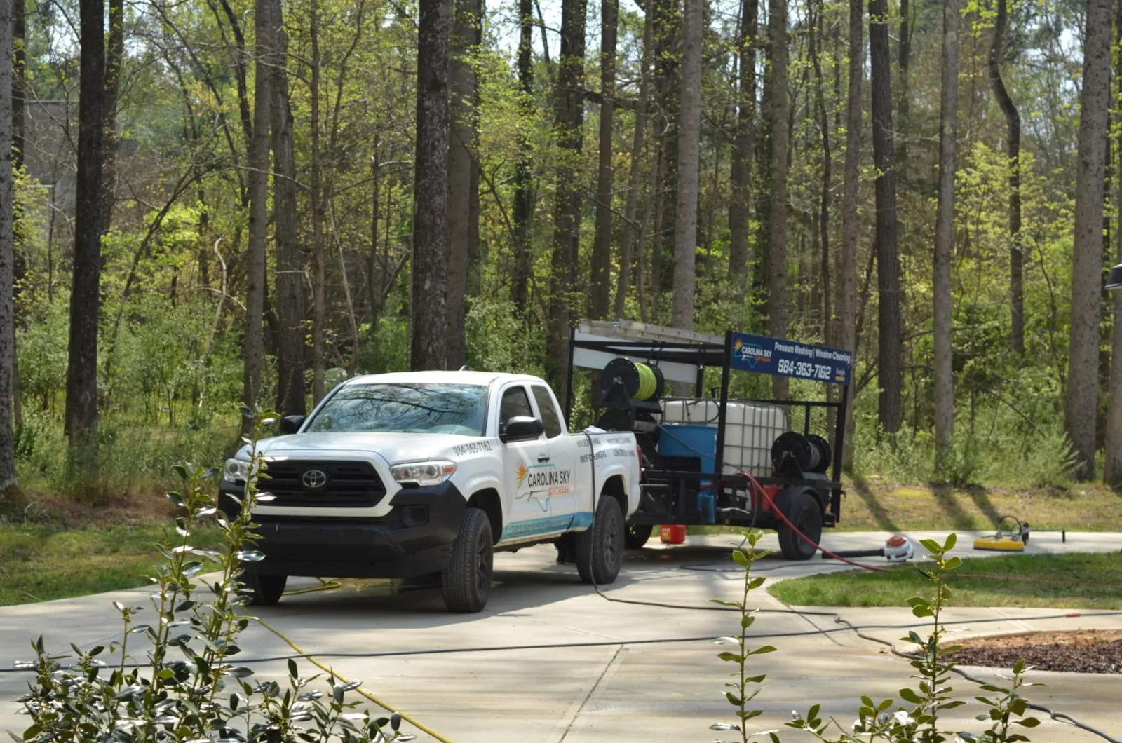 Carolina Sky Softwash truck and wash trailer set up for driveway cleaning