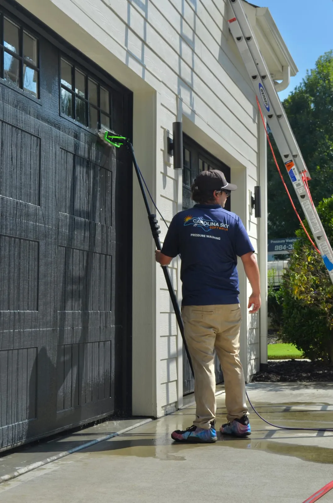 Cleaning garage door glass with a pure-water fed pole